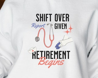 Puede incluir: Sudadera blanca con el texto "Shift Over Report Given" y un estetoscopio rojo, guantes azules y un gorro de enfermera blanco. El texto "Retirement Begins" está debajo del estetoscopio.