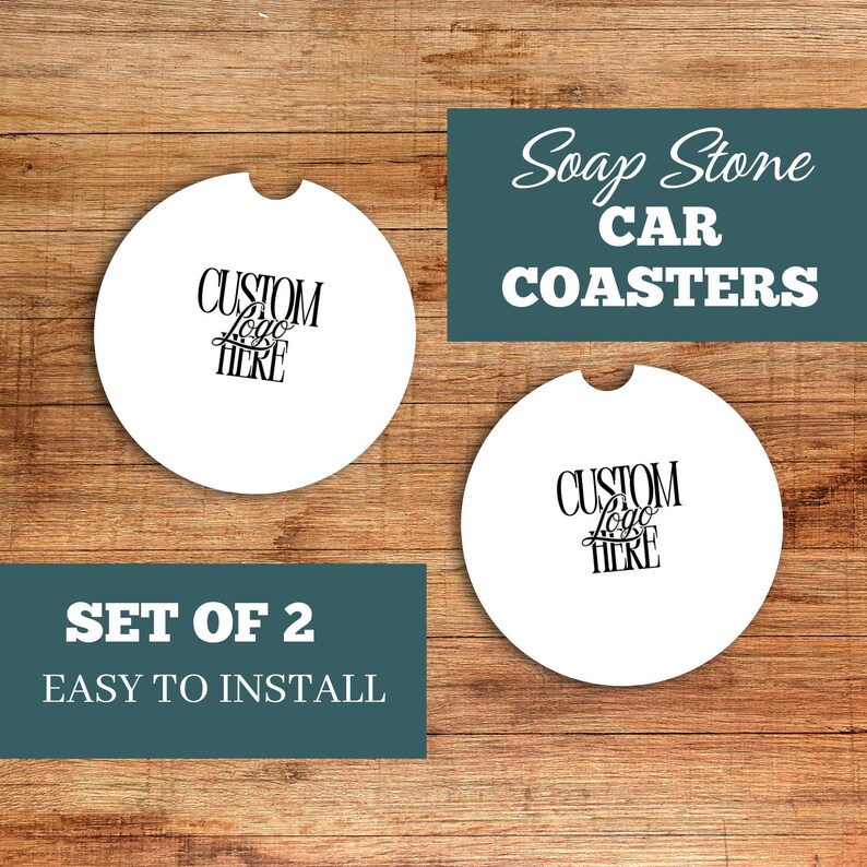 May include: Two white car coasters with a custom logo design. The coasters have a semi-circle cutout and are displayed on a wooden surface. Text on the image reads "Soap Stone Car Coasters" and "Set of 2 Easy to Install."