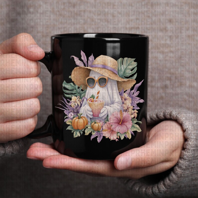 May include: Black ceramic mug featuring a whimsical illustration of a ghost wearing sunglasses and a straw hat, holding a drink. The design includes pumpkins, flowers, and tropical leaves, creating a fun, seasonal theme.