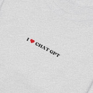 May include: A gray t-shirt with the text "I ♥ CHAT GPT" printed on the front.