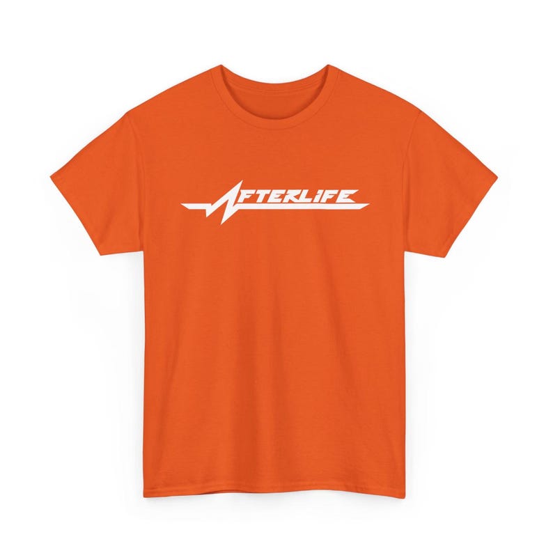 May include: Orange t-shirt with the word "AFTERLIFE" in white, stylized with a heartbeat-like graphic. The shirt is a solid orange color and has short sleeves.
