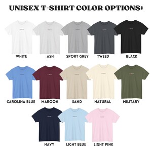 May include: A selection of unisex t-shirts in various colours, including white, ash, sport grey, tweed, black, carolina blue, maroon, sand, natural, military, navy, light blue, and light pink.
