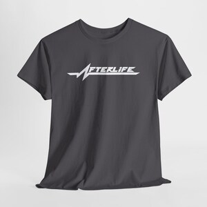 May include: Dark gray t-shirt with the word "AFTERLIFE" in white, stylized with a heartbeat line design. The shirt has short sleeves and a crew neck.