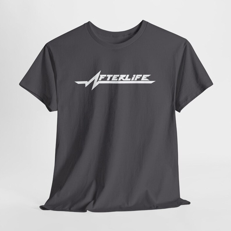 May include: Dark gray t-shirt with the word "AFTERLIFE" in white, stylized with a heartbeat line design. The shirt has short sleeves and a crew neck.