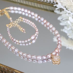 natural freshwater pearl 18k&#39;gold plated necklace.natural freshwater pearl Color light purple pearl .with 18k’ gold beads