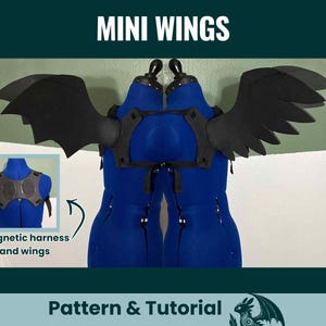 May include: Black mini wings attached to a magnetic harness, displayed on a blue dress form. The image includes the text "MINI WINGS" at the top and "Pattern & Tutorial" at the bottom. A smaller inset shows the harness.