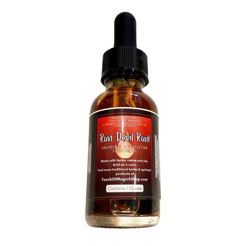 May include: A glass bottle of Run Devil Run! spiritual oil with a black dropper. The label is red and white with the text "Run Devil Run!" and other text. The bottle contains 1 ounce of oil.
