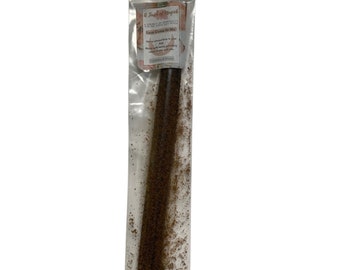 May include: A clear plastic bag containing a brown stick of loose incense. The label on the bag reads "A Touch of Magic" and "Love Comes to Me".