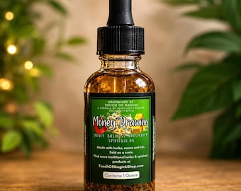 May include: A glass bottle of Money Drawing Spiritual Oil with a black dropper. The label is green and features the text "Money Drawing" and "Contains 1 Ounce". The bottle is filled with a golden liquid and small particles.