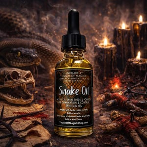 May include: A bottle of Snake Oil with a black dropper, the label reads "HANDMADE BY TOUCH OF MAGICK". The bottle is surrounded by candles, a snake, and a skull. The text on the label says "WITH REAL SNAKE SHEDS & POWDER FOR DOMINATION & CONTROL SPIRITUAL OIL".