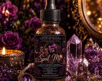 May include: A brown glass bottle of "Spoil Me" spiritual oil with a black dropper, surrounded by purple crystals, flowers, and a pendant. The label reads "Handmade Spiritual Oil by Touch of Magick" and "You Deserve It All". The bottle contains 1 ounce.