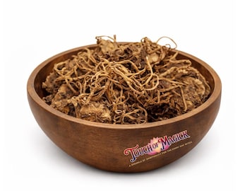 Può includere: Una ciotola di legno piena di erbe secche marroni. La ciotola ha una finitura liscia e scura e un logo che dice "Touch of Magick". Le erbe sembrano radici e hanno una consistenza aggrovigliata e fibrosa.