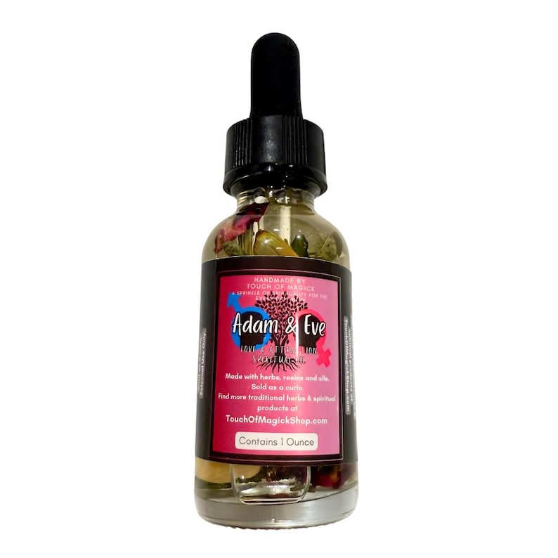 May include: A clear glass bottle with a black dropper and a black cap. The bottle contains a liquid with herbs and flowers. The label reads "Adam & Eve" and "Contains 1 Ounce".