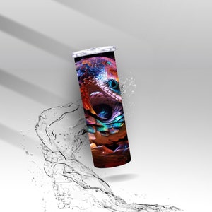 May include: A stainless steel tumbler with a colorful snake design. The snake is a vibrant mix of red, orange, blue, green, and purple. The tumbler is perfect for keeping drinks cold or hot.