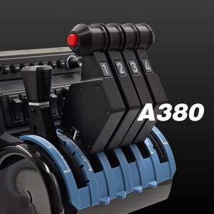 May include: A black and blue aircraft control panel with four black levers and a large knob. The levers have red buttons and numbered labels 1 through 4. The panel is labeled "A380".
