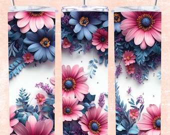 Op de afbeelding: Een set van drie roestvrijstalen tumblers met een bloemenontwerp. De tumblers hebben roze en blauwe papieren bloemen op een witte achtergrond.