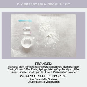 May include: A DIY breast milk jewelry kit with a white powder, a small blue spatula, two clear tubes with purple tops, and a white bowl. The text on the image reads "DIY Breast Milk Jewelry Kit", "PROVIDED:", "Stainless Steel Pendant, Stainless Steel Earrings, Stainless Steel Chain, Gloves, 2-Part Resin, Syringe, Mixing Cup, Toothpick, Wax Paper, Pipette, Small Spatula, Clay, & Preservation Powder", "WHAT YOU NEED TO PROVIDE:", "5 ml Breast Milk, Spatula, Double Boiler, & Metal Spoon".