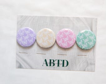 Juego de imanes con botones de mariposa pastel