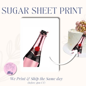 May include: A rectangular sugar sheet print featuring a rose gold champagne bottle with a red rose emblem. The print is displayed next to a white cake topped with gold and pink spheres, showing the bottle graphic applied to the side of the cake.