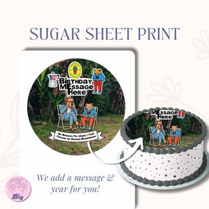 May include: A sugar sheet print with a circular design featuring two cartoon frogs, one taking a photo. The design includes the text "BIRTHDAY MESSAGE HERE" and a banner with text. A cake with the same design is shown.