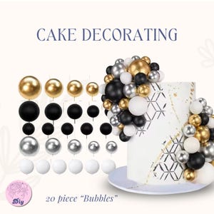 May include: Cake decorating set with gold, black, silver, and white bubble-shaped decorations. The image includes a decorated cake with the same bubble accents and the text "CAKE DECORATING" and "20 piece 'Bubbles'".