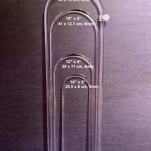 May include: Four clear acrylic arches of varying sizes. The largest is 18" x 6" (46 x 15 cm, 8mm), followed by 16" x 5" (41 x 12.7 cm, 6mm), 12" x 4" (30 x 11 cm, 6mm), and 10" x 3" (25.5 x 8 cm, 6mm). Each arch has a rounded top and pointed base.