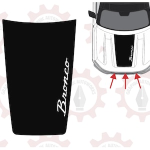 May include: Black hood graphic with the word "Bronco" in white script. The graphic is designed to fit a vehicle's hood. The image also shows a top-down view of a white vehicle with a black stripe and the word "Bronco".