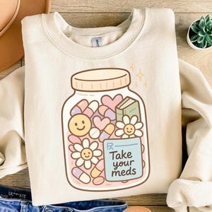 Neem je medicijnen in, png-bestand | Geestelijke gezondheid herinnering clipart | Leuke digitale pastelkleurige sticker | Zelfzorg transparant png-bestand | Esthetische pilfles