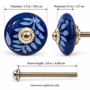 May include: A round blue ceramic cabinet knob with a light blue leaf pattern and a gold-tone metal center. The knob has a 1.5 inch diameter, a 0.5 inch projection, and includes a 2.6 inch long screw as indicated by the text labels.