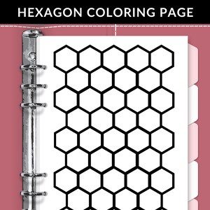 May include: A white coloring page with a black hexagon pattern is held in a pink binder. The text "HEXAGON COLORING PAGE" is at the top. The binder has silver metal rings and white divider tabs.