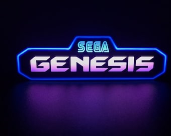 May include: A blue and purple neon sign with the text "SEGA GENESIS" in white.