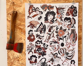May include: A print featuring various tattoo-style illustrations, including a tiger, dragon, woman's face, and a gun. The print is held by clips on a wooden board, with an axe hanging on the left side. The text "tender prey" is visible.