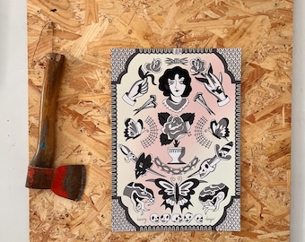 May include: A framed tattoo-style art print featuring a woman's portrait, roses, butterflies, snakes, and hands. The print has a pink and white background with black and gray illustrations. An axe is mounted on the wooden frame.