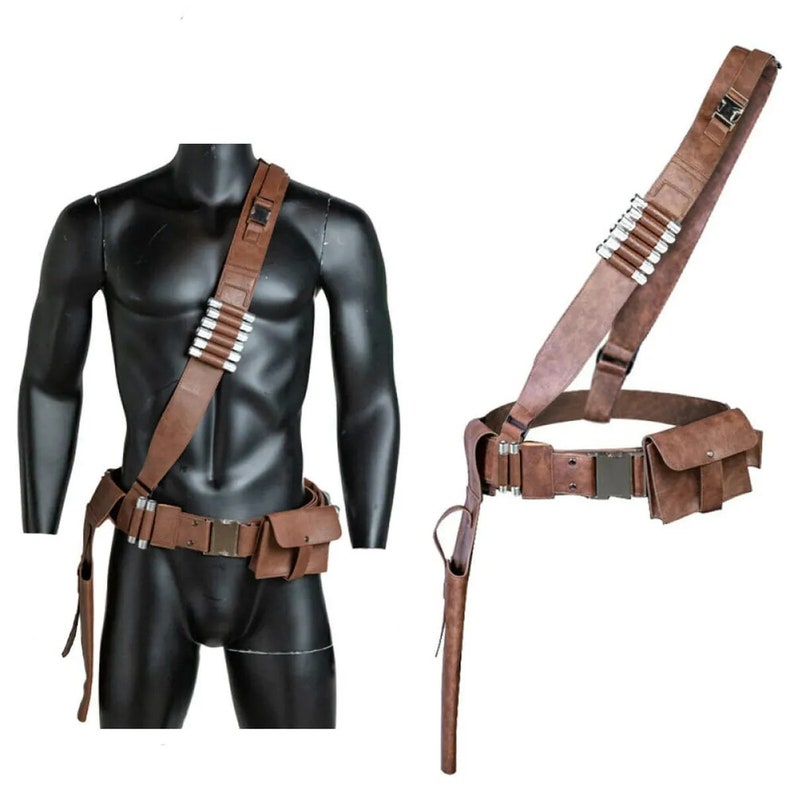 May include: A brown leather belt with a holster and a shoulder strap. The belt has a silver buckle and a pouch on the right side. The shoulder strap has a silver buckle and a pouch on the left side.