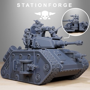 May include: A gray miniature tank model with a long barrel and multiple figures on top. The model has detailed tracks and various mechanical components. The text "STATIONFORGE" and a skull logo are visible at the top.