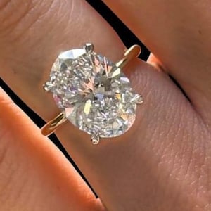 Oval Moissanite Hidden Halo Engagement Ring: 14K Gold Solitaire