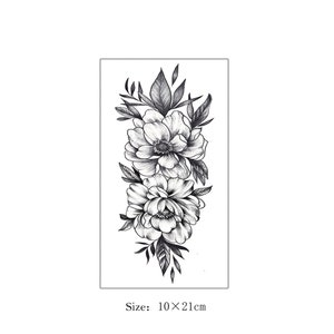 May include: Black and white floral temporary tattoo with two large flowers and leaves. Size: 10 x 21 cm.