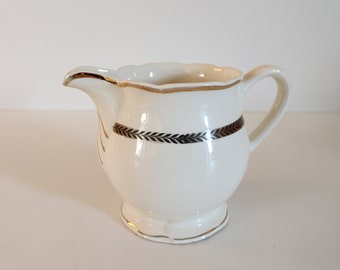 Digoin Sarreguemines - Turenne - Ecru and gold milk jug in opaque porcelain