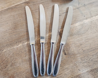 Set of 4 beautifully crafted vintage stainless steel knives