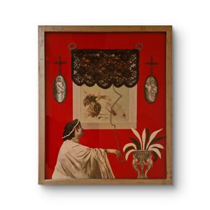May include: Framed artwork with a red backdrop, depicting a woman in a draped garment, a black lace curtain, and religious imagery. The artwork includes a decorative vase with a plant and a wooden frame.
