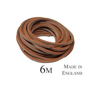 Może przedstawiać: Rolka 6 metrów brązowego sznurka skórzanego. Wyprodukowano w Anglii.