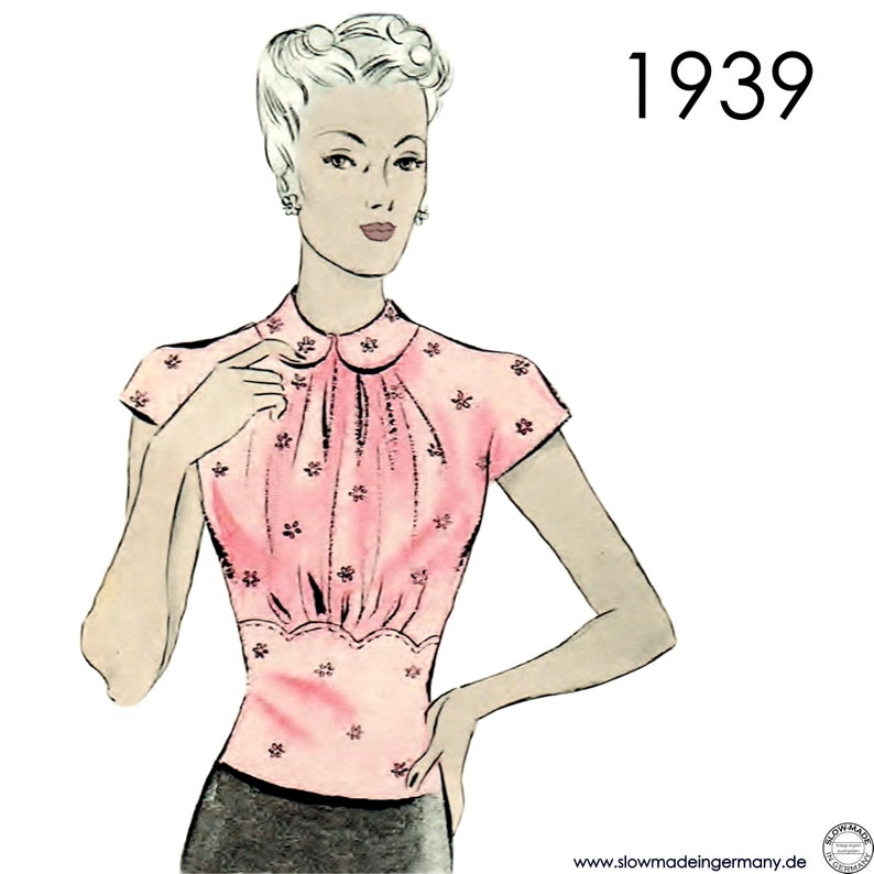 May include: A vintage illustration of a woman wearing a pink blouse with a peter pan collar and short sleeves. The blouse has a gathered neckline and a fitted bodice. The illustration is labeled "1939".