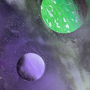Spray paint art - crackled green and purple planets