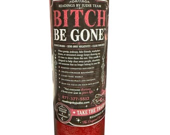 May include: A tall, cylindrical red wax candle in a clear glass jar. The label features the text BITCH BE GONE in bold, pink lettering, along with detailed instructions, the phone number 877-377-5512, and the website readingsbyjudie.com.