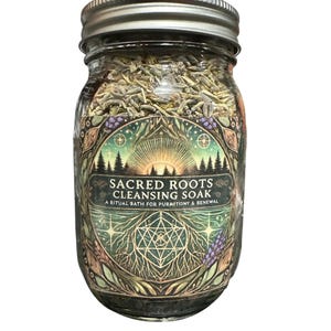 May include: A glass jar with a silver lid filled with dried herbs. The jar has a label with the text "Sacred Roots Cleansing Soak" and a nature-themed design with trees, a sun, and geometric shapes.