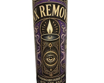 May include: A glass jar candle with a black base and a purple and gold label. The label features the text "X REMOVE" and an illustration of a candle with an eye. The website readingsbyjudie.com and a phone number are also printed on the label.