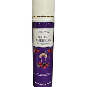 May include: A purple air freshener spray bottle with a white top and gold band. The label reads "Ohli-Way NATIVE AMERICAN Air Freshener." It features illustrations of berries and a Native American headdress. Net wt. 8.45 fl. oz.