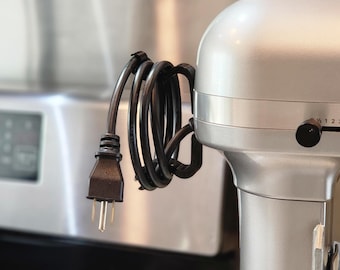 KitchenAid Lift Bowl Stand Mixer Cord Wrap Storage Clip. Kitchen Aid cord management device for Lift-Bowl mixers. Does NOT fit Tilt-Bowl.
