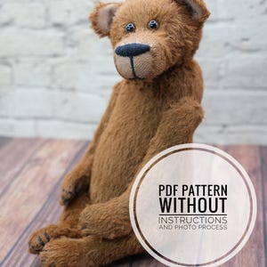 May include: A brown teddy bear sitting on a wooden surface. The bear has black eyes and a black nose. The text "PDF PATTERN WITHOUT INSTRUCTIONS AND PHOTO PROCESS" is in a white circle on the right side of the image.