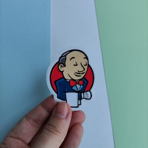 Peut inclure: Un autocollant repr&eacute;sentant un dessin anim&eacute; d'un homme en costume bleu et cravate rouge tenant une tasse de caf&eacute;. L'homme a une moustache et sourit. L'autocollant est sur un fond blanc.